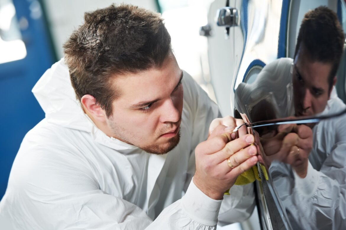 Man removing scratches on car
