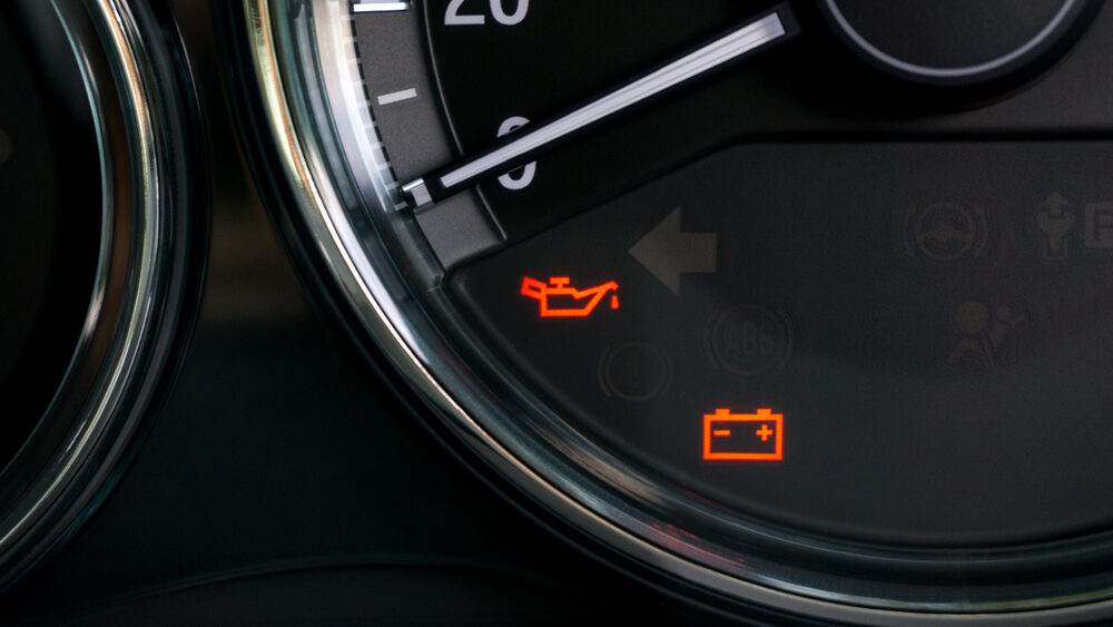 Close up of car speedometer and indicators signs that shows that car needs a repair