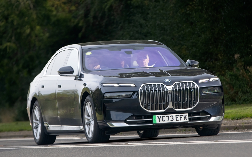 BMW I7 EDRIVE50 EXCELLENCE electric car driving on an English country road.