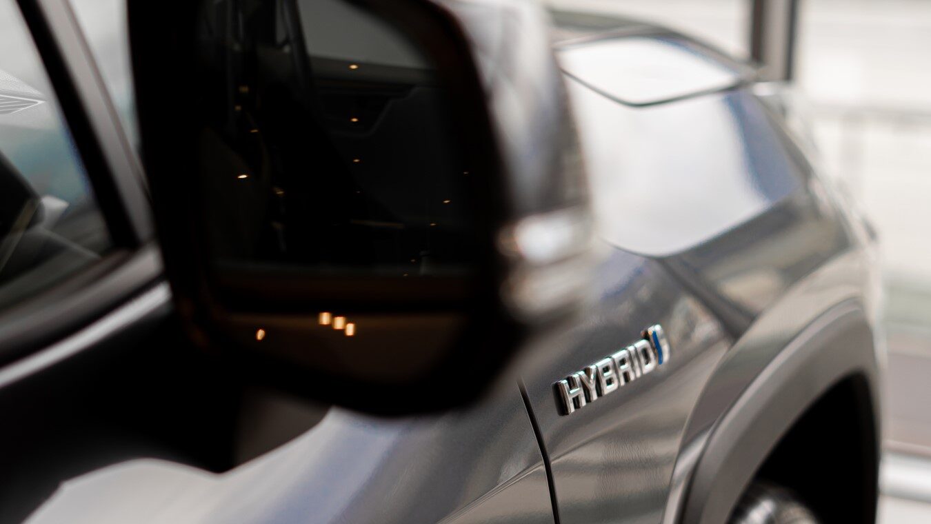 Close up of Hybrid logo on a hybrid car